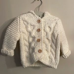 Beautiful cream Huggalugs, hand knit Size 0-6 mo sweater w/ hood.